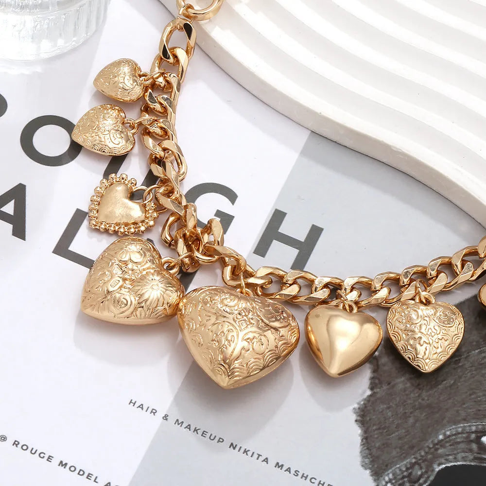 Exaggerated heart pendant necklace with dripping oil treatment in gold colour
