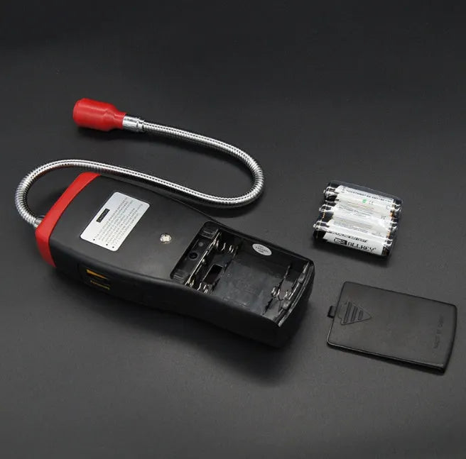 AS8800L portable flammable gas detector with LED alarm light, shown with three AA batteries.