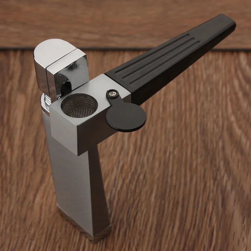 Metal pipe lighter with folding flap covering lighter mechanism and stash compartment
