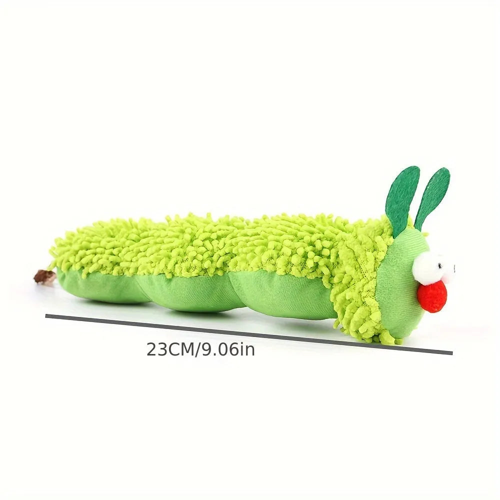 Green interactive plush cat toy with a feather teaser, shown next to a tape measure indicating 24 cm length.