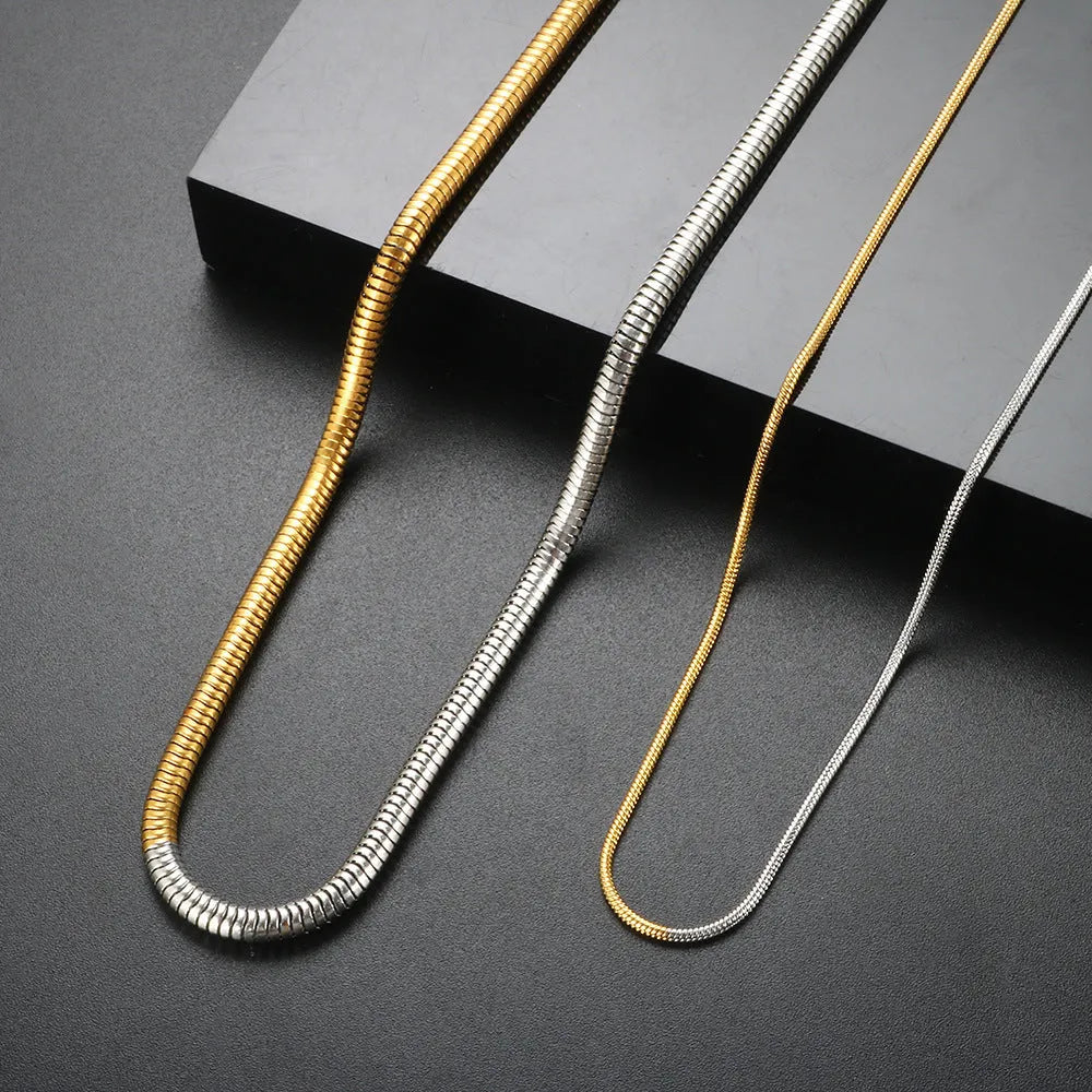 Gold-toned women's snake bones chain necklace with 3mm thick geometric links.