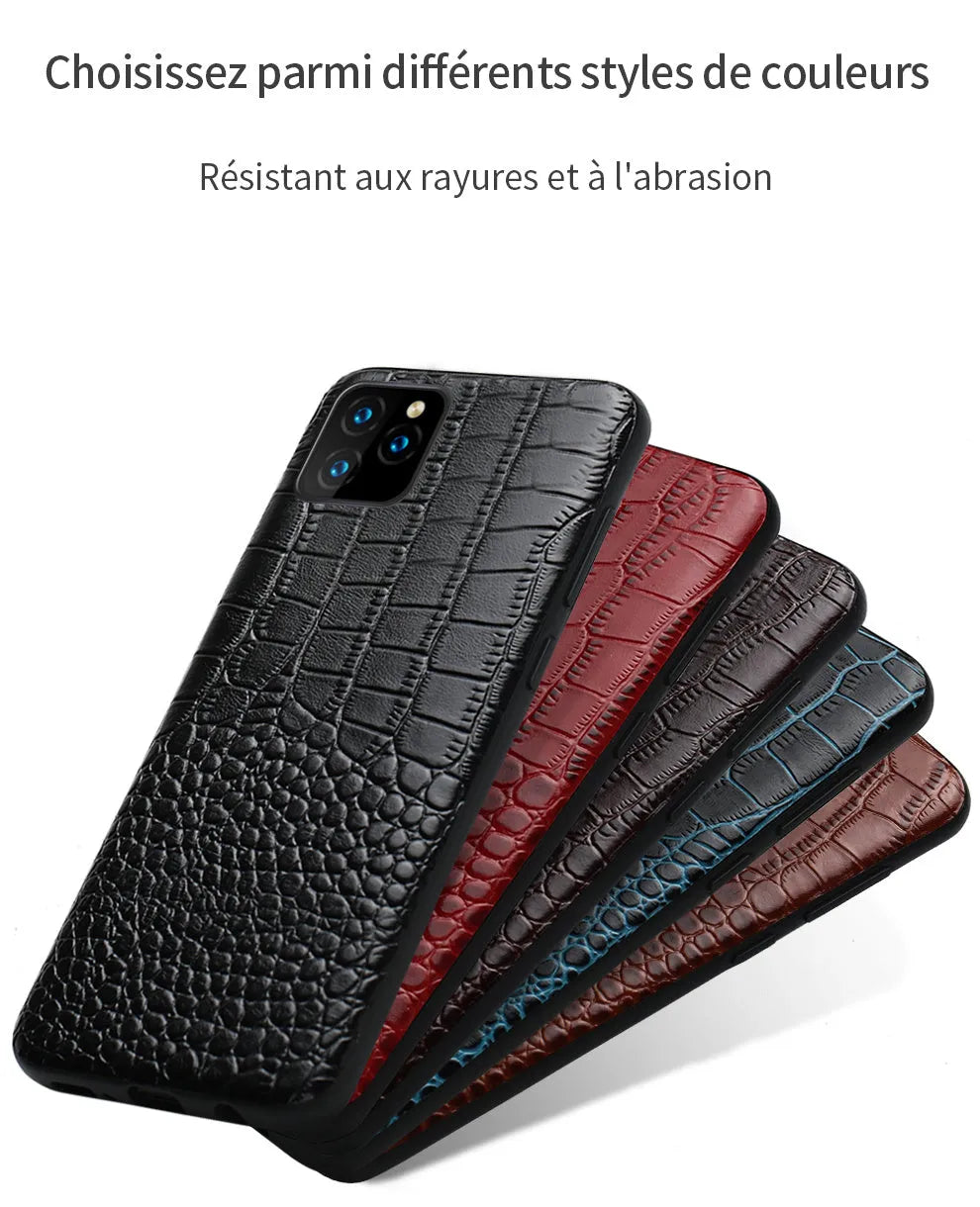 Black crocodile pattern leather back cover case for an iPhone on a wooden surface.