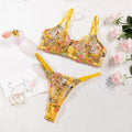 Floral pattern mesh bra and underwear set with T-back straps and 3/4 cups.
