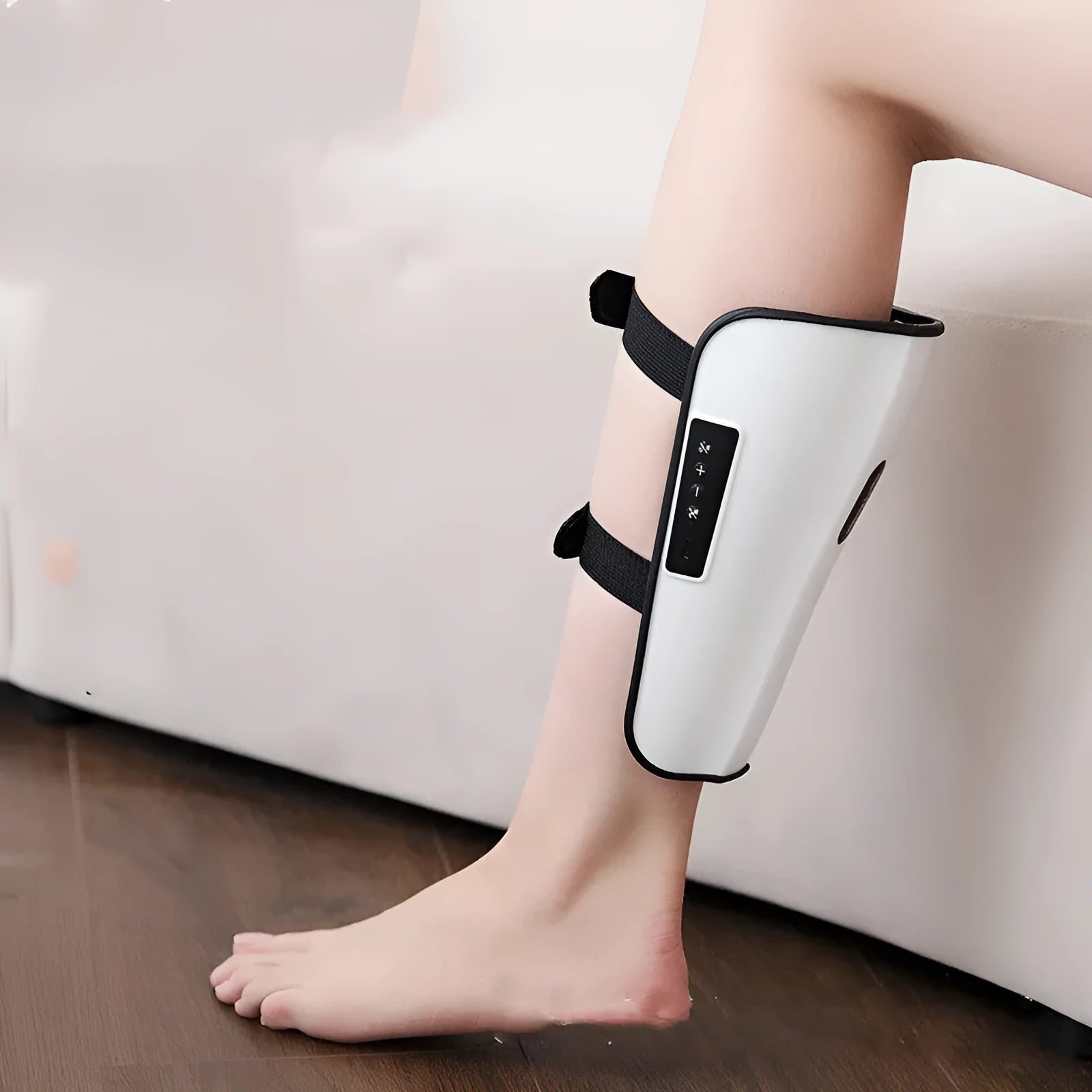 White plastic pulse calf massager with infrared physiotherapy and electrotherapy vibration functions
