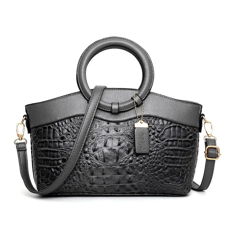 Fabric ladies casual shoulder handbag in multiple colours showing zipper and organisational pockets.