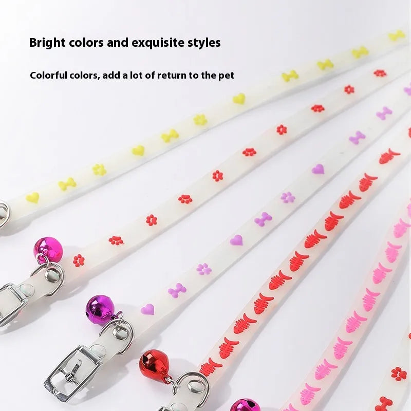 Luminous adjustable cat collar with a metal bell in a paw print pattern on a silicone rope.