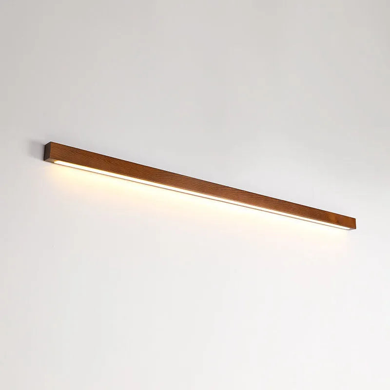 Walnut colour linear wood and acrylic wall lamp in three lengths with minimalist square profile