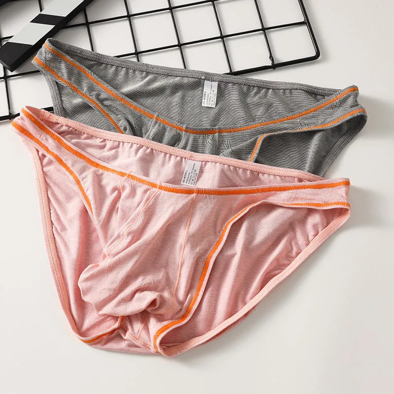 Men's knitted modal butt-lift hip underwear shown in one of five colour options: dark gray, pink, yellow green, colourful blue, or sky blue.