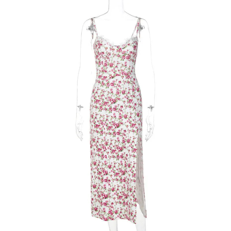 Women's long dress with lace flowers print, thigh-high slit, and suspender straps in blue.
