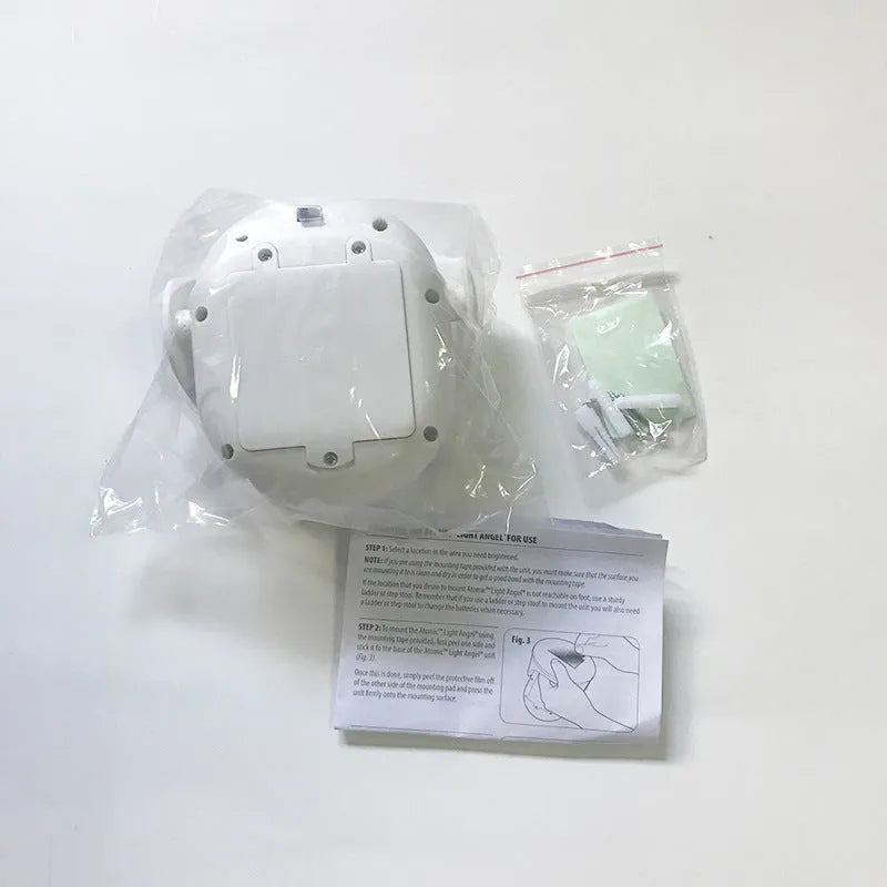 White Atomic Angel induction light with ABS plastic housing measuring 13.3 by 9.8 by 15.8 centimetres