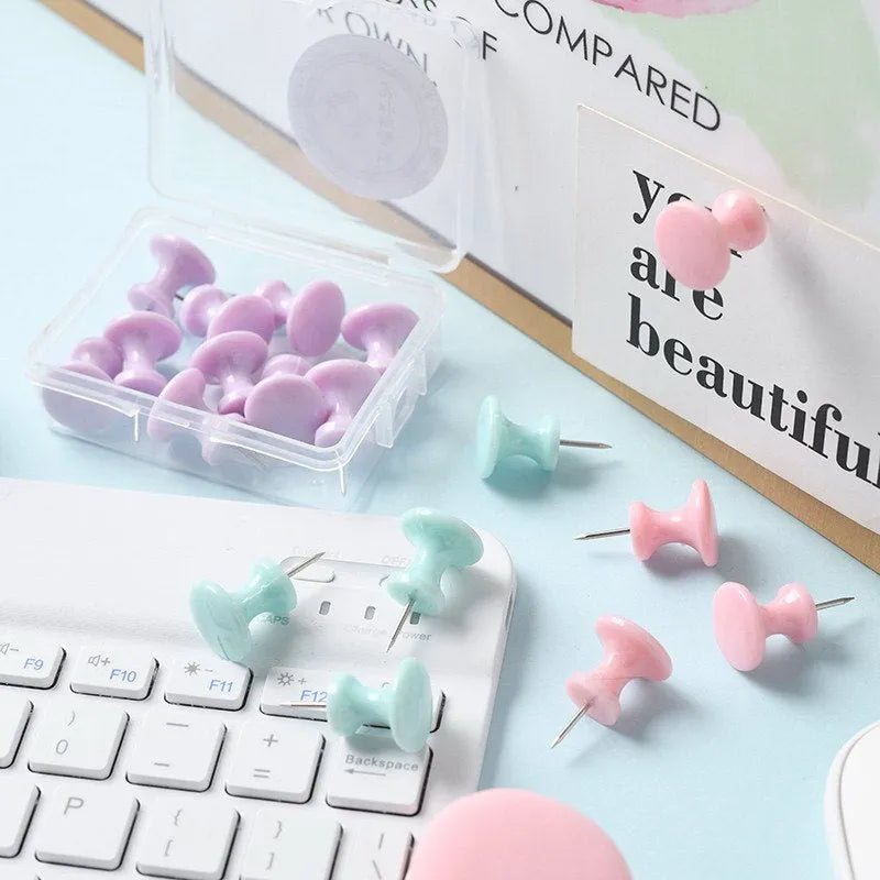 Boxed set of macaron-coloured plastic push pins in cherry blossom pink, mint green, and lavender, showing large and small sizes.