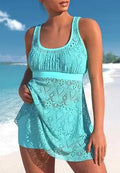 Women's solid colour two-piece swimsuit with sleeveless top and briefs, made from nylon fabric.