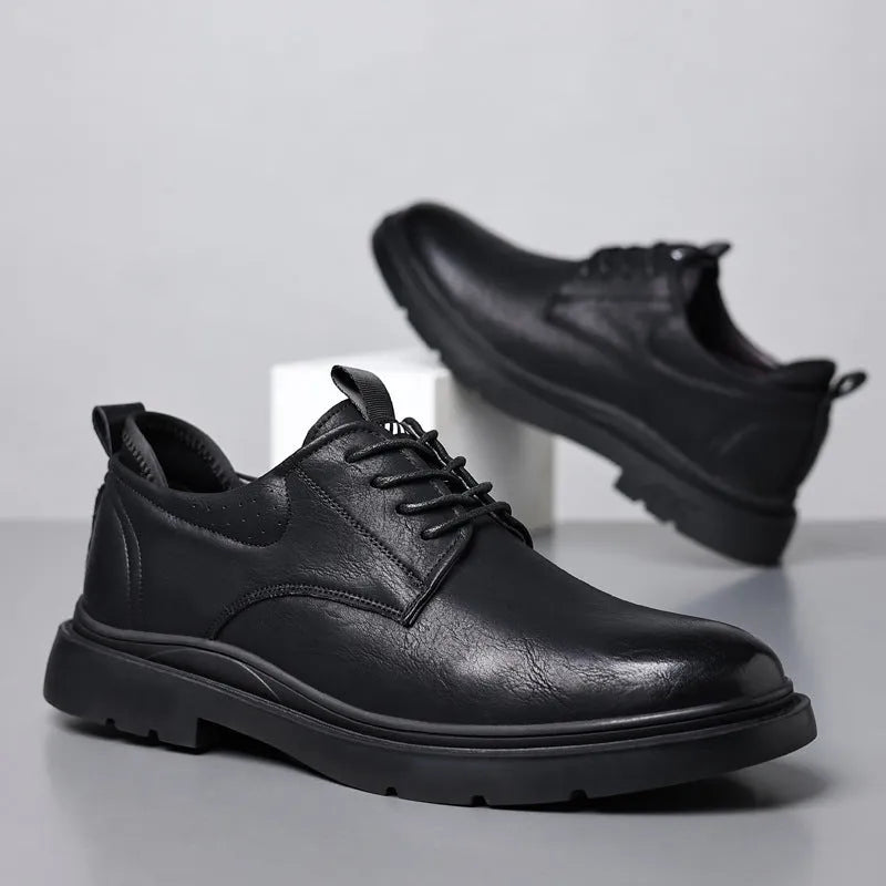 Men's black and brown leather casual sneakers with decorative stitching and a rubber sole.