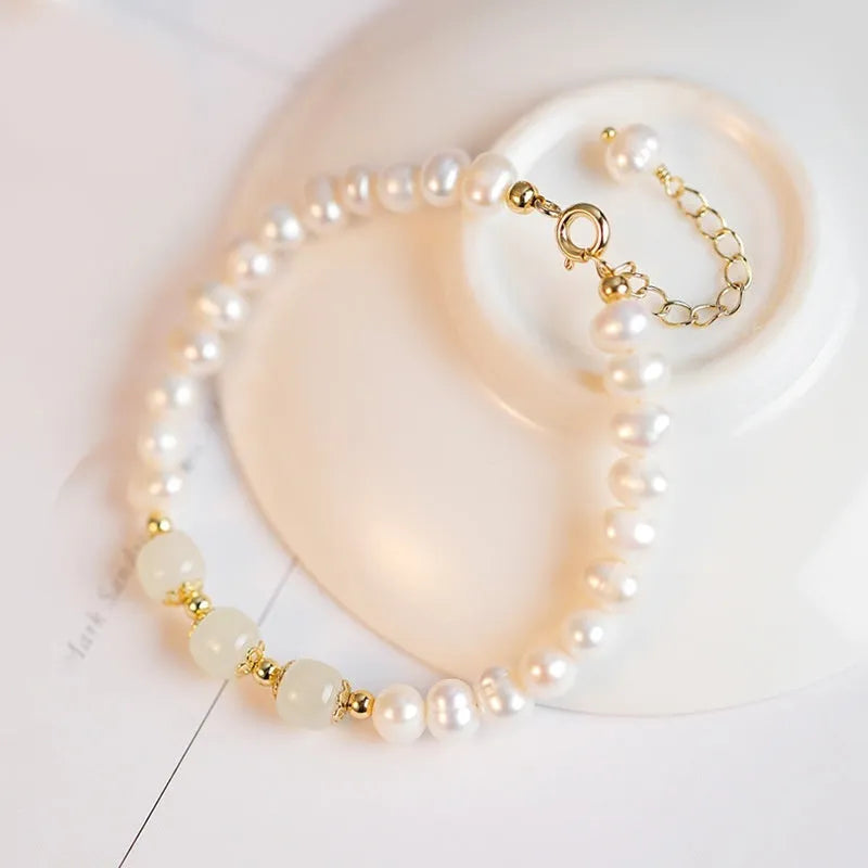 Natural freshwater pearl bracelet with diamond-shaped pearls in a Korean style, shown in deep Hetian jade colour.