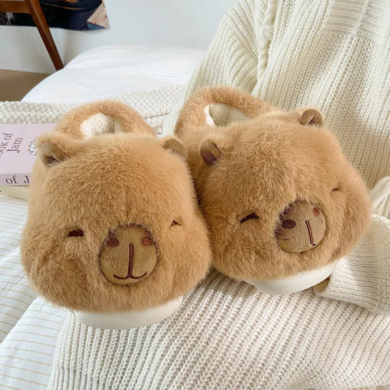 Light brown women's winter slippers with a cartoon pattern, plush upper, and round toe.
