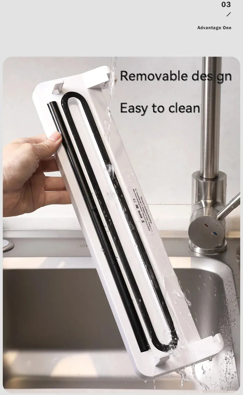 Compact black automatic vacuum sealer for household food preservation and item storage