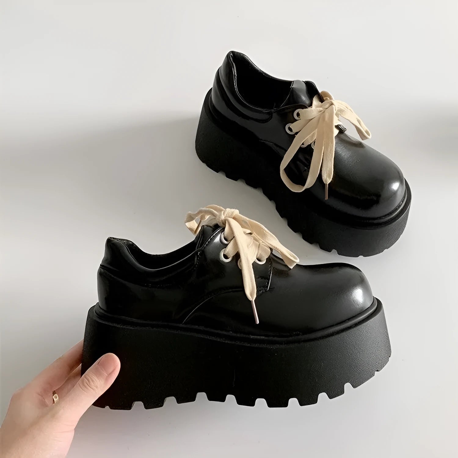 Women's matte black retro lace-up shoes with thick rubber sole and block heel.