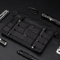 Black oxford cloth portable outdoor kit measuring 18cm by 3.5cm