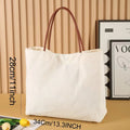 Beige white canvas tote bag with reinforced cotton handles and a flat base.