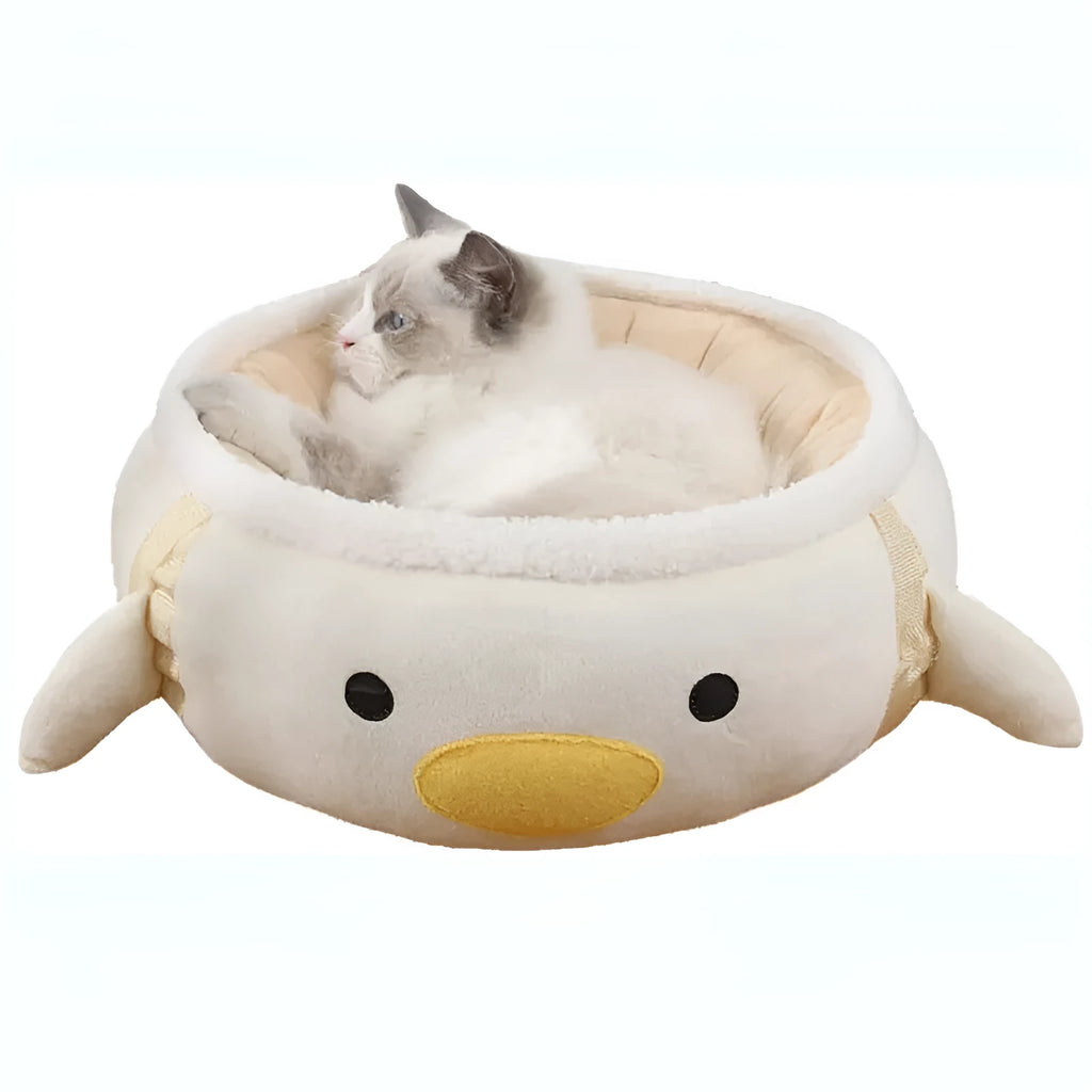 Green chick and dinosaur shaped cat bed shown both flat as a nest and hanging as a hammock for small pets.
