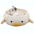 Green chick and dinosaur shaped cat bed shown both flat as a nest and hanging as a hammock for small pets.