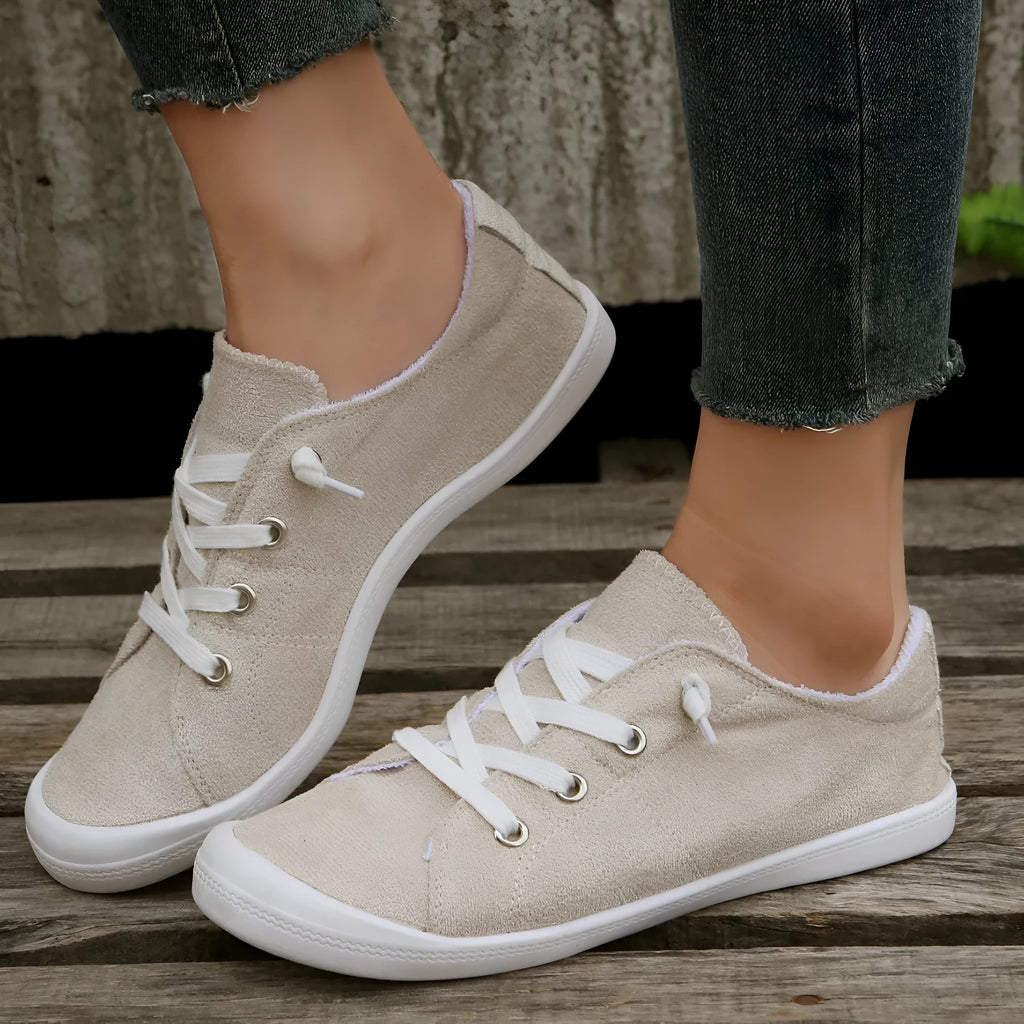 Women's creamy white fabric casual sneakers with rubber sole low top design
