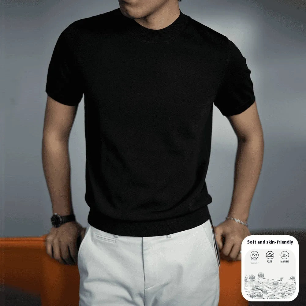 Man wearing a solid colour knitted t-shirt with round neck and short sleeves, showcasing business casual style.