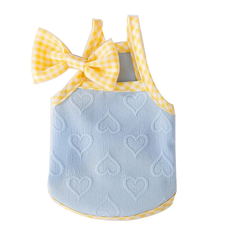 Small dog wearing heart texture bow suspenders vest in elastic material