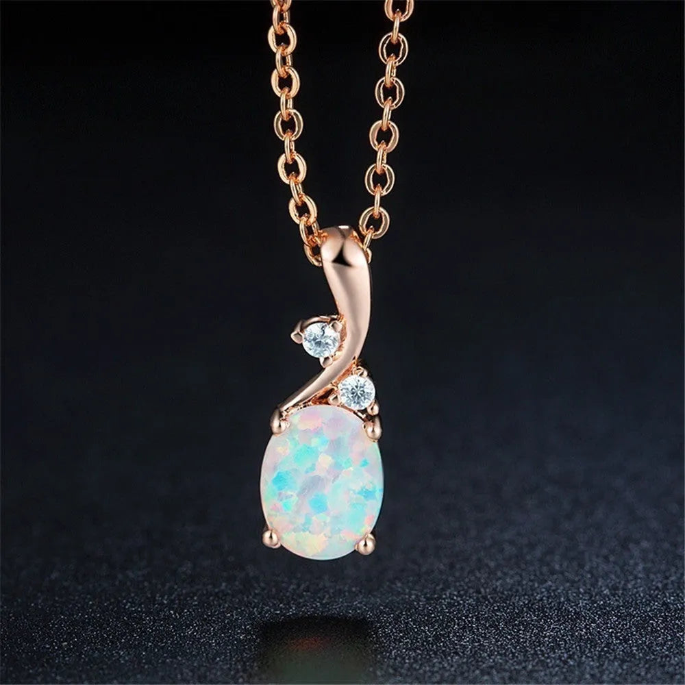 Water drop shaped opal pendant necklace with adjustable chain in white or rose gold finish