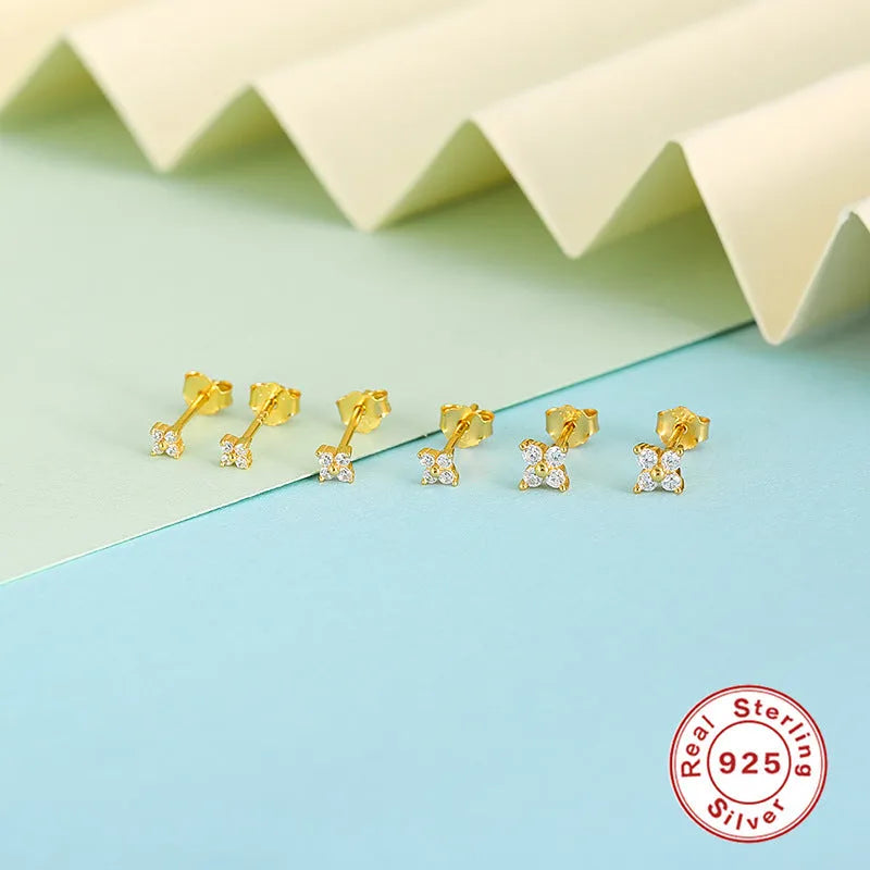 S925 sterling silver stud earrings with a geometric petal and crystal flower design in gold and platinum finishes.