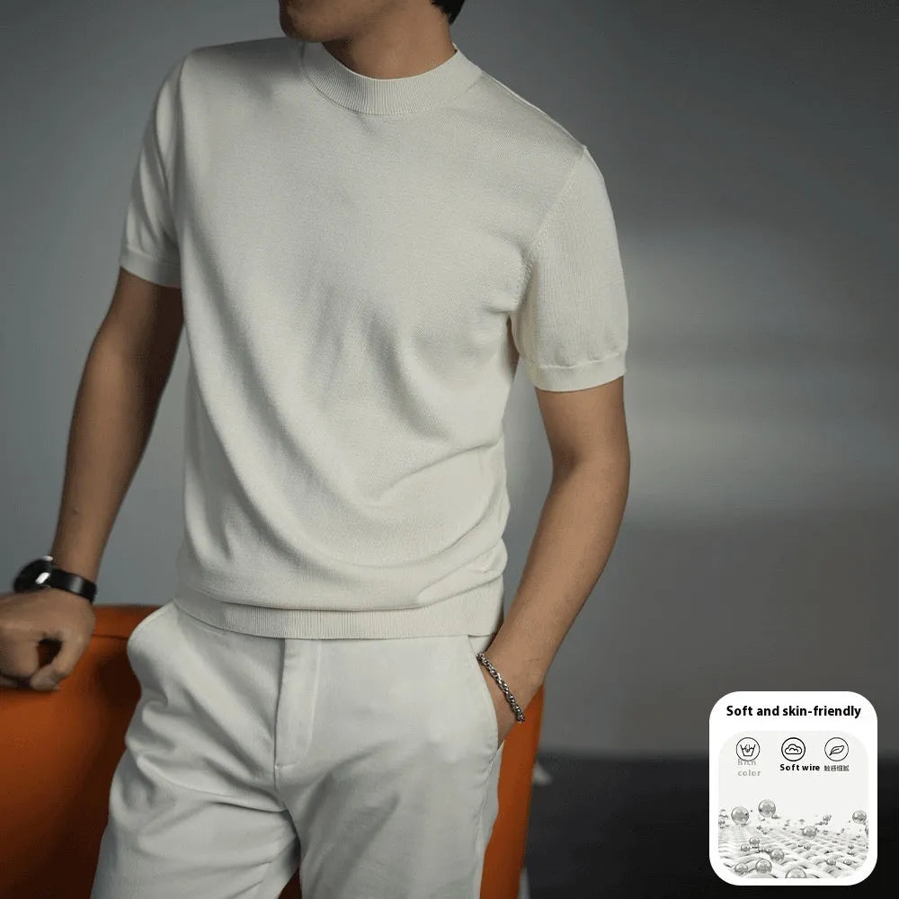 Man wearing a solid colour knitted t-shirt with round neck and short sleeves, showcasing business casual style.