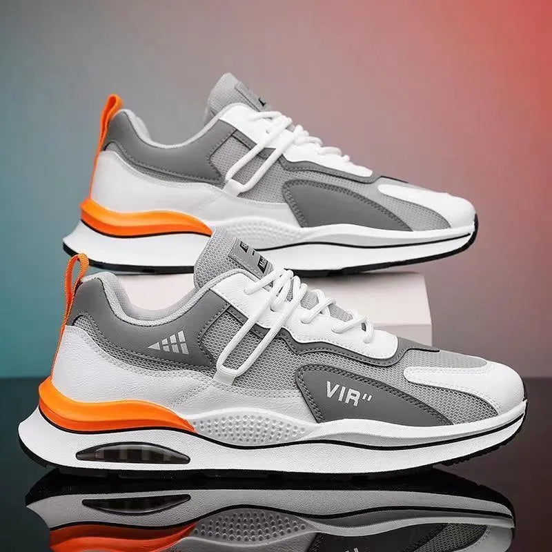 Men's gray mesh running shoes with round toe and visible stitching, shown from side view