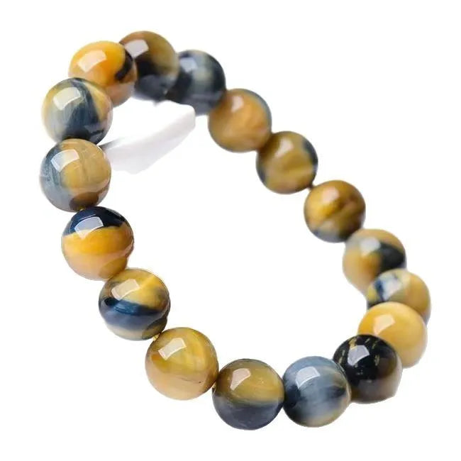 Fantasy Tiger Eye agate bracelet with round beads in a single circle design on a wrist.