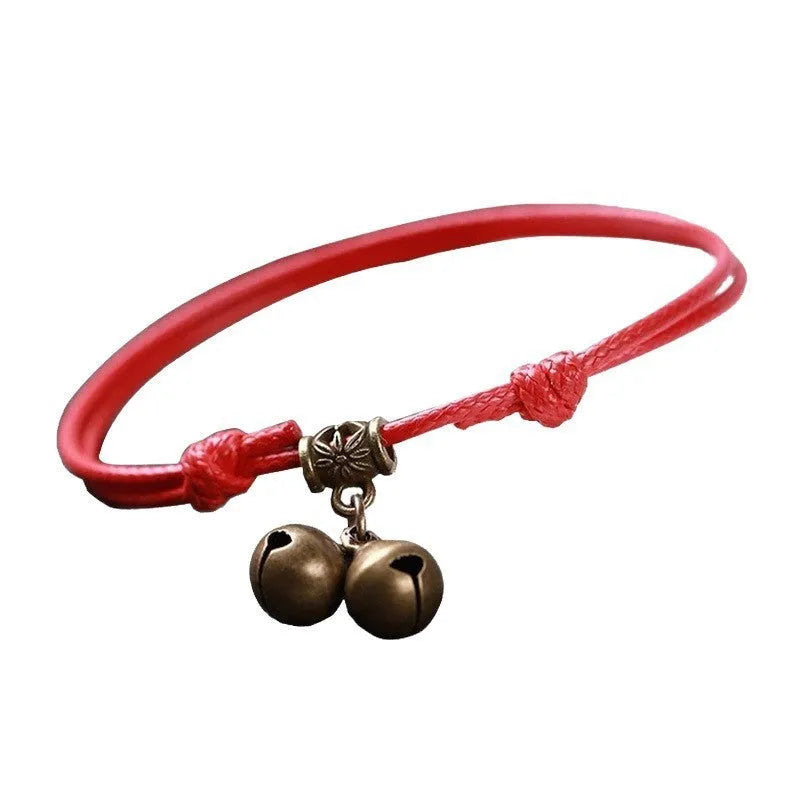 Small adjustable nylon dog collar with brass bell in black, red, or coffee colours