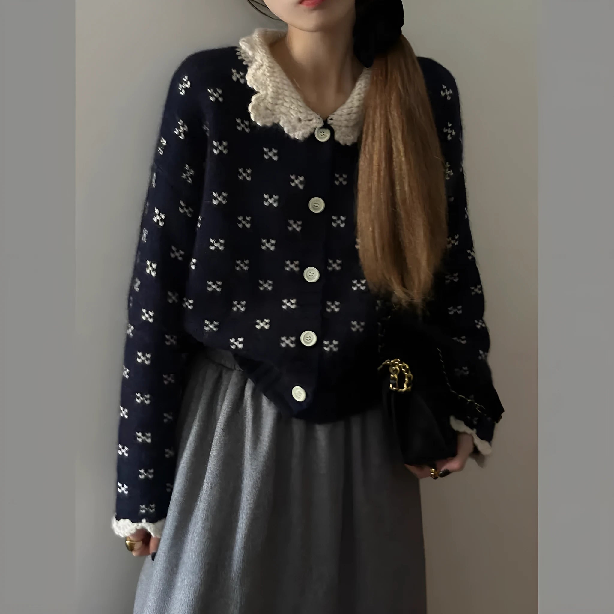 Knitted cardigan coat with Peter Pan collar in navy blue with floral pattern