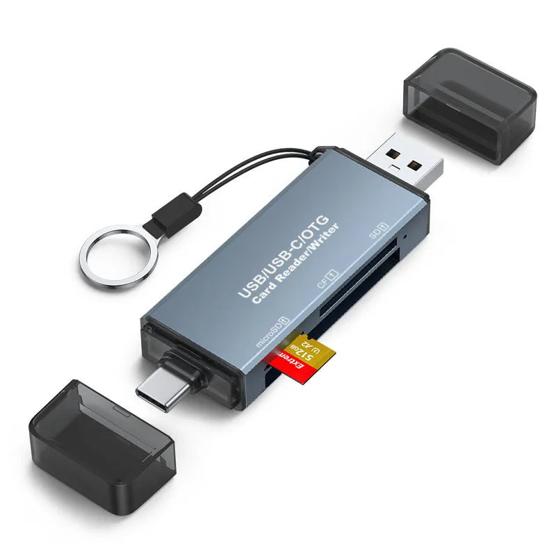 Silver aluminium alloy USB card reader with CF, SD, and TF slots on a desk.