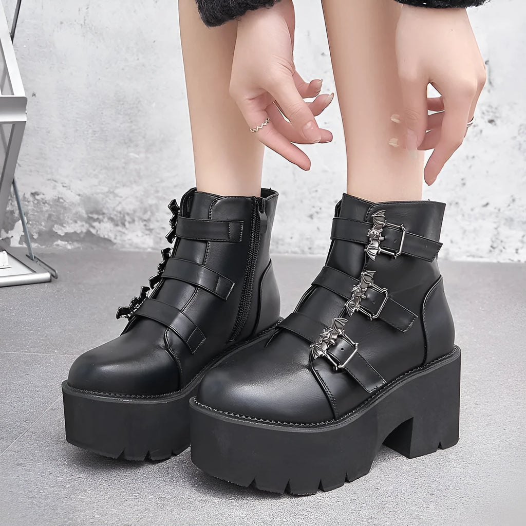 Black women's punk ankle boots with bat buckle and side zip, thick platform heel