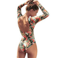 Women's backless one-piece swimsuit with a tropical leaf floral print in a conservative style.