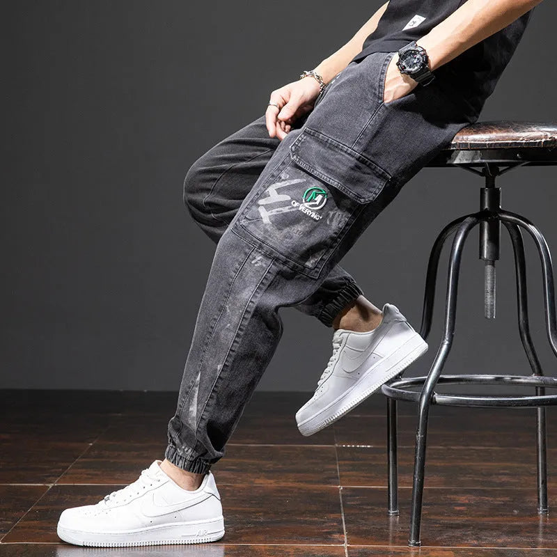 Men's loose fit straight leg cargo jeans in cotton with micro elasticity, shown in blue.
