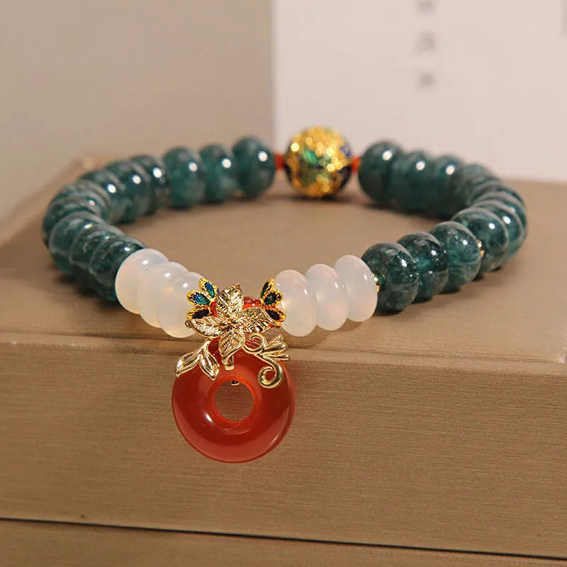 Women's blue water jade and red agate crystal bracelet with peace buckle closure