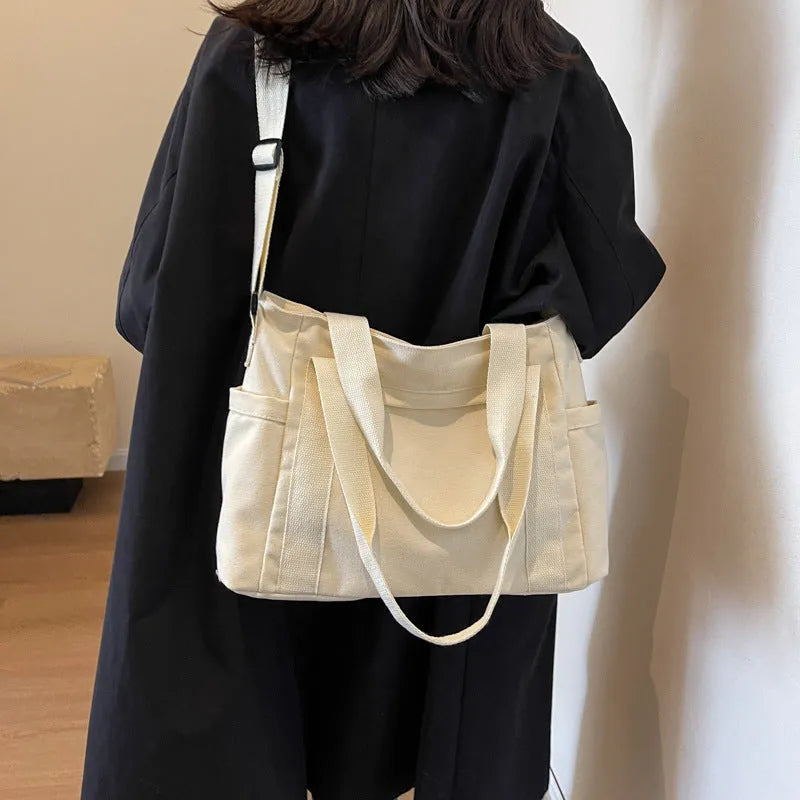 Large capacity polyester shoulder bag for women in four colours with mobile phone compartment