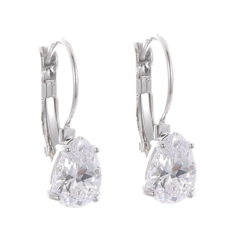 Drop-shaped women's fashion earrings in gold or platinum finish with an inlaid gem