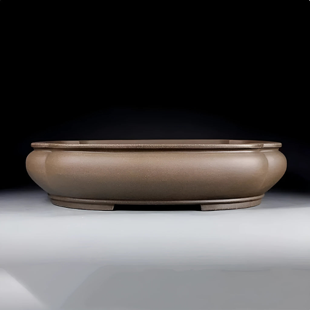 Handmade antique papaya-shaped purple clay flower pot, 46cm long, on a wooden surface.