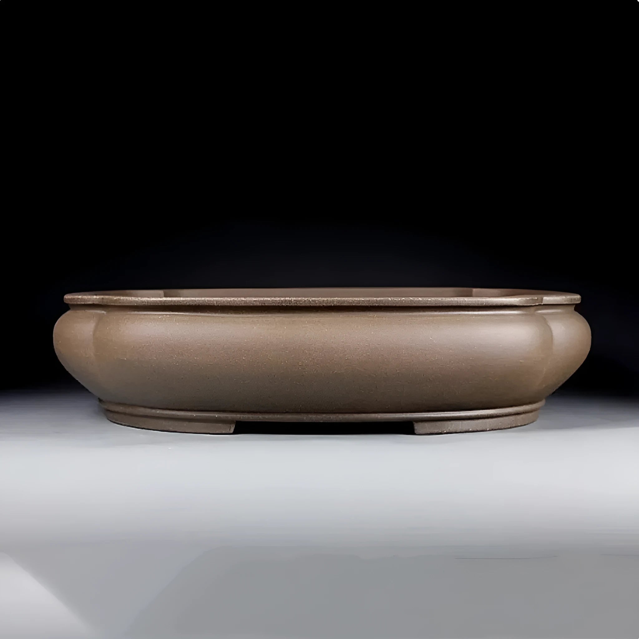 Handmade antique papaya-shaped purple clay flower pot, 46cm long, on a wooden surface.