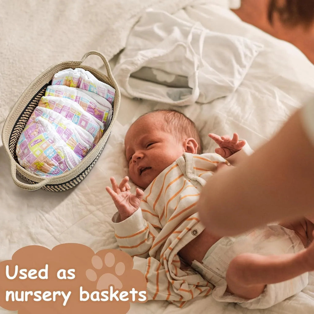 Light beige handmade cotton rope storage basket with wooden details and a handle.
