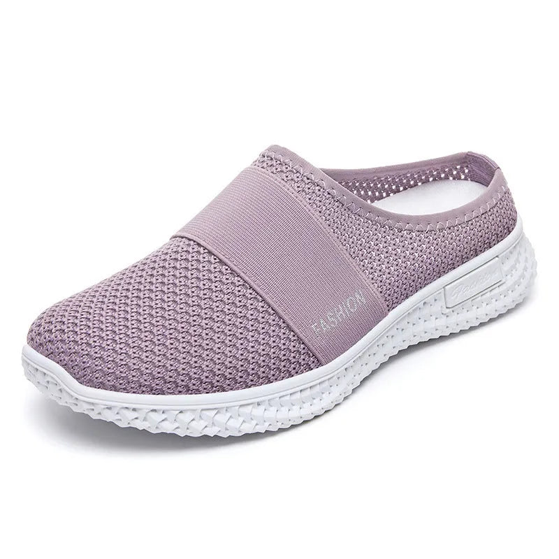 Women's black breathable mesh casual shoes with hollow-out details and a flat round toe.