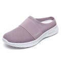 Women's black breathable mesh casual shoes with hollow-out details and a flat round toe.