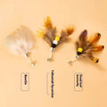 Three steel wire cat toy replacement heads with flying insect designs in different colours