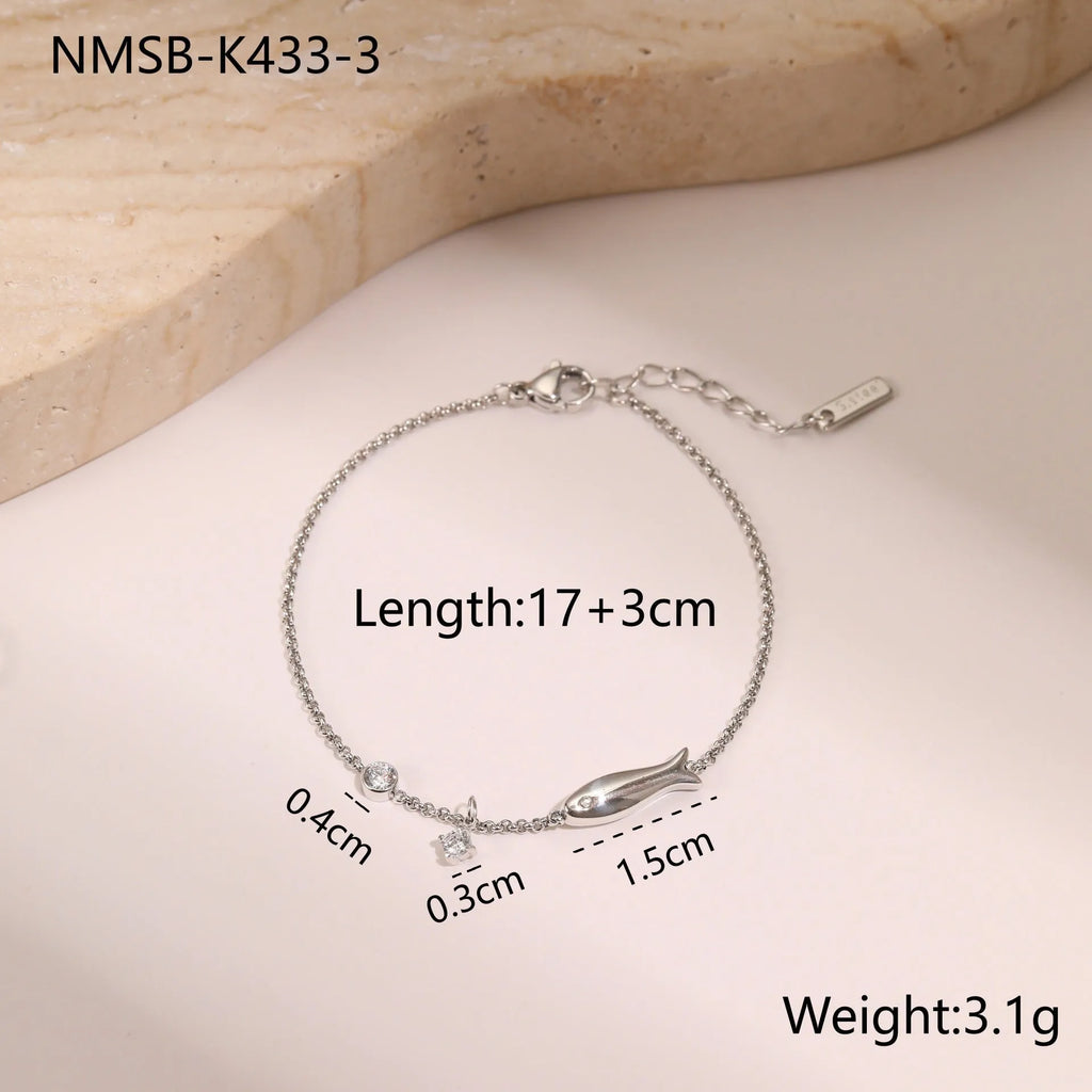 Gold electroplated stainless steel bracelet with a geometric star-shaped pendant.