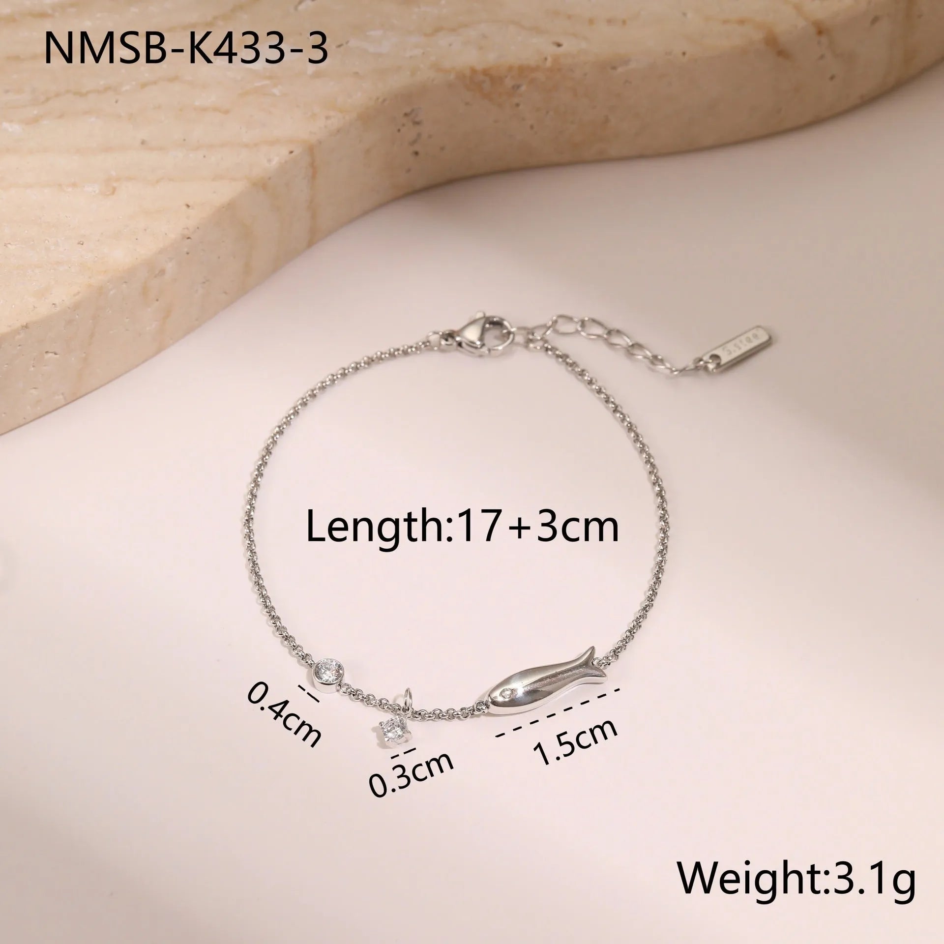 Gold electroplated stainless steel bracelet with a geometric star-shaped pendant.